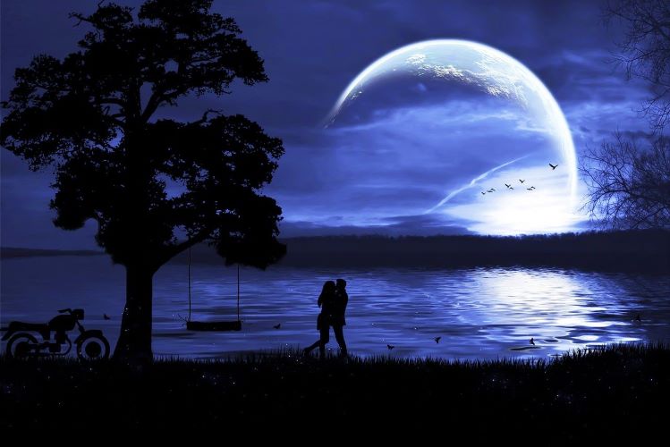 Couple in the moonlight chasing dreams.